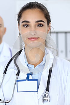 Happy doctor woman with medical staff at the hospital