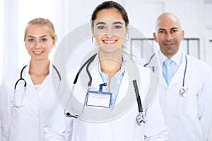 Happy doctor woman with medical staff at the hospital