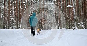 A happy dog walks with a loving new owner. A new life for pets