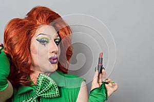 Happy drag queen artist doing makeup
