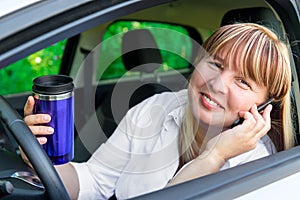 Happy driver behind the wheel of a car