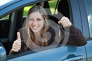 Happy driver with car key