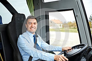 Happy driver driving intercity bus