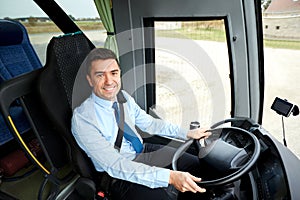 Happy driver driving intercity bus