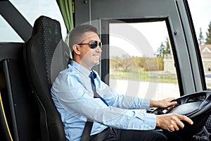 Happy driver driving intercity bus