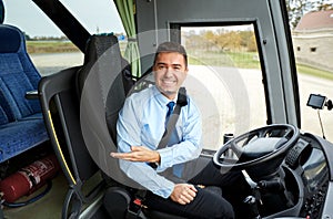 Happy driver inviting on board of intercity bus