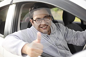 Happy Driver Shows Thumb Up and Smile