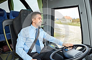 Happy driver talking to microphone and driving bus