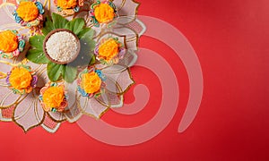 Happy Dussehra. Yellow flowers, green leaf and rice on red background. Dussehra Indian Festival concept