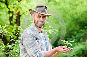 Happy earth day. Eco living. farming and agriculture cultivation. Gardening. muscular ranch man in cowboy hat care