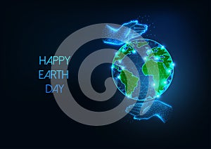 Happy Earth Day web banner with futuristic glowing low polygonal planet globe and caring human hands