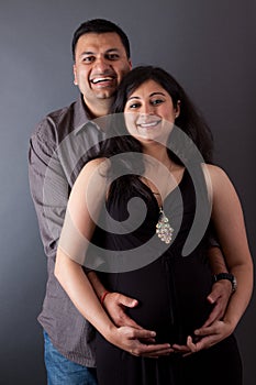 Happy East Indian Husband with his Pregnant wife