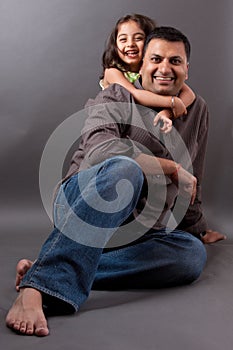 Happy East Indian man with his daughter