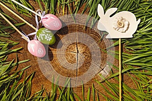 Happy easter artificial eags witht rabbit wooden backgroung