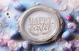 Happy Easter Background; Easter egg and spring flowers on blue t