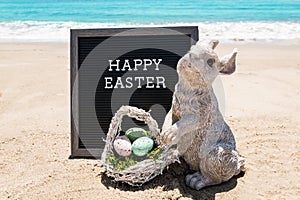 Happy Easter beach background with black board and bunny