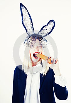 Happy Easter bunny. Young woman are preparing for Easter celebration. Bunny rabbit eat carrot and looks very sensually