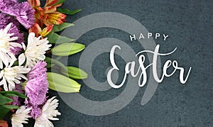 Happy Easter Calligraphy Holiday Script With Colorful Spring Flowers Over Blackboard Background Texture