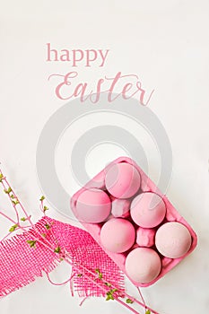 Happy Easter card; pink colored eggs on white background, with d