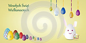 Happy Easter card in Polish language with painted Easter eggs and rabbit.