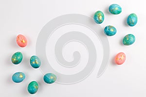 Happy easter card. Stylish minimalistic composition of turquoise with gold easter eggs on a white background. Flat lay