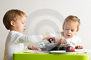 Happy easter. Children painted eggs. Two kids preparing for Easter. Painted hand. Finger paint. Art and craft concept