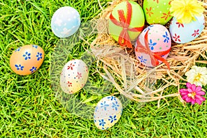 Happy easter! Closeup Colorful Easter eggs on green grass field