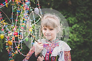 Happy easter compliment from girl in national folk costume