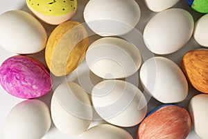 Happy Easter concept. Closeup of easter eggs with different color on white background