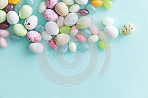 Happy Easter concept. Preparation for holiday. Easter candy chocolate eggs and jellybean sweets isolated on trendy