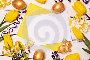 Happy Easter. Congratulatory easter background. Easter eggs and flowers