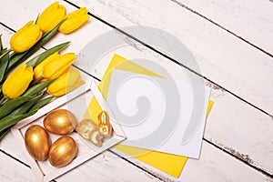 Happy Easter. Congratulatory easter background. Easter eggs and flowers