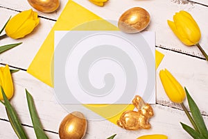 Happy Easter. Congratulatory easter background. Easter eggs and flowers