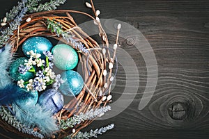 Happy Easter. Congratulatory easter background. Easter eggs and flowers. Background with copy space. Selective focus.