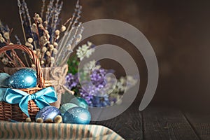 Happy Easter. Congratulatory easter background. Easter eggs and flowers. Background with copy space. Selective focus.