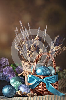 Happy Easter. Congratulatory easter background. Easter eggs and flowers. Background with copy space. Selective focus.