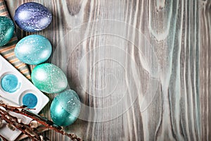 Happy Easter. Congratulatory easter background. Easter eggs and flowers. Background with copy space. Selective focus.