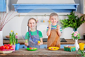 Happy easter. Cute brother and sister, funny kids boy and girl are preparing for the holiday