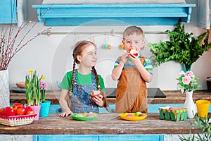 Happy easter. Cute brother and sister, funny kids boy and girl are preparing for the holiday.