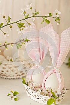 Happy easter. Decor of Easter eggs in small white baskets