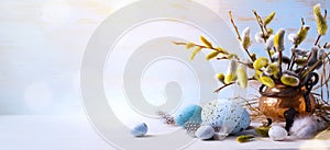 Happy Easter Easter eggs and sprig flowers on blue table background