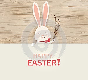 Happy Easter. Easter Rabbit Bunny standing behind a blank sign, showing on big sign. Happy smiling Cute, funny cartoon