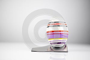 Happy Easter! Easter Egg in an eggcup for breakfast, egg in eggcup for easter breakfast