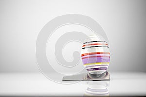 Happy Easter! Easter Egg in an eggcup for breakfast, egg in eggcup for easter breakfast