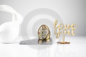 Happy Easter! Easter Egg in an eggcup for breakfast, egg in eggcup for easter breakfast