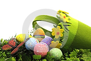 Happy Easter Egg Hunt Spring scene with pretty green and yellow daisy basket with eggs and butterfly