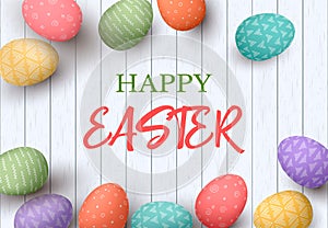 Happy Easter eggs frame with text. Colorful easter eggs on white wooden background. Your design