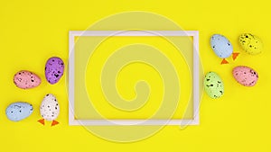 Happy Easter eggs move around frame for text on yellow theme. Stop motion