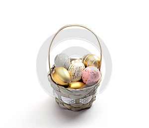 Happy Easter eggs white background. Golden shine decorated eggs in basket, for greeting card, promotion, poster