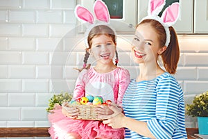 Happy easter! family mother and child daughter with ears hare ge